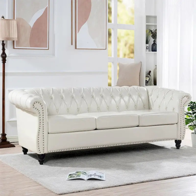 Canapé Chesterfield capitonné en similicuir avec accoudoirs roulés (84,65)