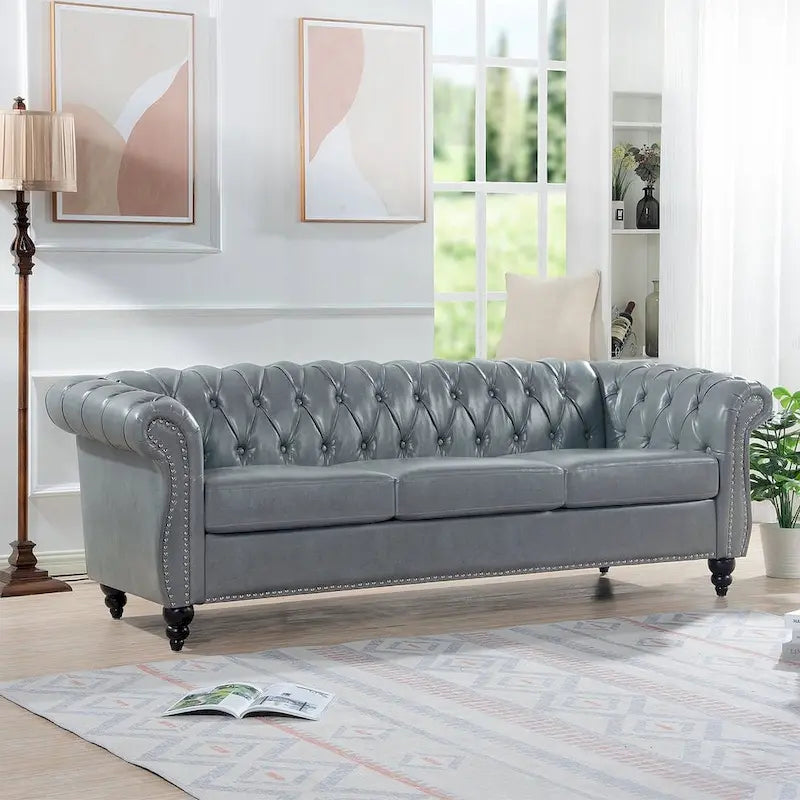 Canapé Chesterfield capitonné en similicuir avec accoudoirs roulés (84,65)
