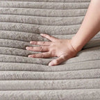 Canapé-lit double moderne, confortable et moelleux, revêtu de velours côtelé doux et moelleux.